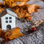 Autumnal,Background.,Toy,House,And,Dried,Orange,Fall,Maple,Leaves