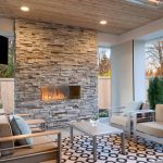 Luxury,Outdoor,Relaxing,Living,Room,With,Large,Stone,Fireplace,,Tv,